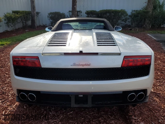 2012 Lamborghini Gallardo z VIN ZHWGU6BZ7CLA11933, wystawiony jako Copart lot #74679154 z przebiegiem Nie podano mil oraz Szkoda całkowita • Salvage title. Historia ofert i sprzedaży dostępna na DreamBid. Obrazek 6.