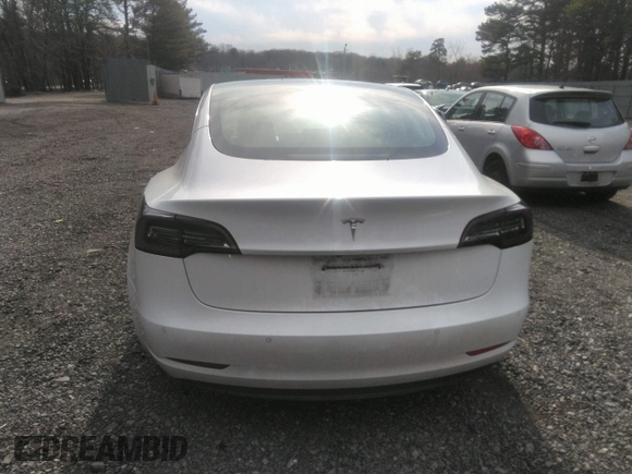 2020 Tesla Model 3 Standard Range Plus with VIN 5YJ3E1EA4LF792830, listed as a IAAI auction lot 41852919 with 76,461 mi miles. Bid and sale history available at carsss.com. Image 16.