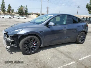 2022 Tesla Model Y Performance z VIN 7SAYGDEF0NF511223, wystawiony jako Copart lot #55314095 z przebiegiem 65 242 mil mil oraz Szkoda całkowita • Salvage title. Historia ofert i sprzedaży dostępna na DreamBid. Obrazek 1.