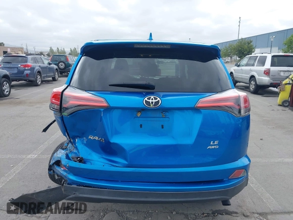 2018 Toyota RAV4 LE with VIN 2T3BFREV6JW740214, listed as a IAAI auction lot 42106349 with 105,831 mi miles and . Bid and sale history available at carsss.com. Image 17.