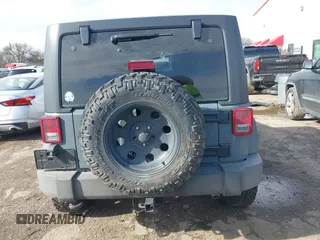 2014 Jeep Wrangler Unlimited Sport with VIN 1C4BJWDG9EL309763, listed as a IAAI auction lot 41378132 with 117,029 mi miles. Bid and sale history available at carsss.com. Image 16.