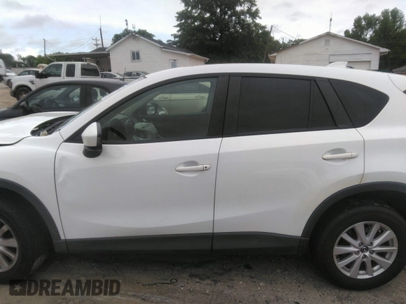 2014 Mazda CX-5 Touring z VIN JM3KE4CY0E0303748, wystawiony jako IAAI lot #42127406 z przebiegiem Nie podano mil oraz . Historia ofert i sprzedaży dostępna na DreamBid. Obrazek 13.