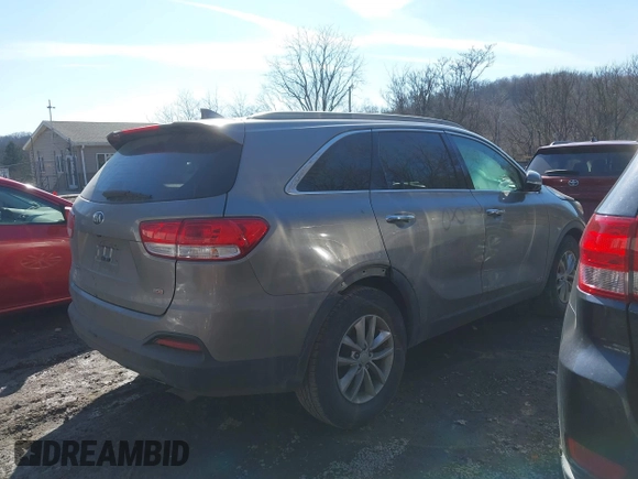2016 Kia Sorento LX with VIN 5XYPGDA39GG061748, listed as a IAAI auction lot 41720011 with 124,084 mi miles. Bid and sale history available at carsss.com. Image 4.