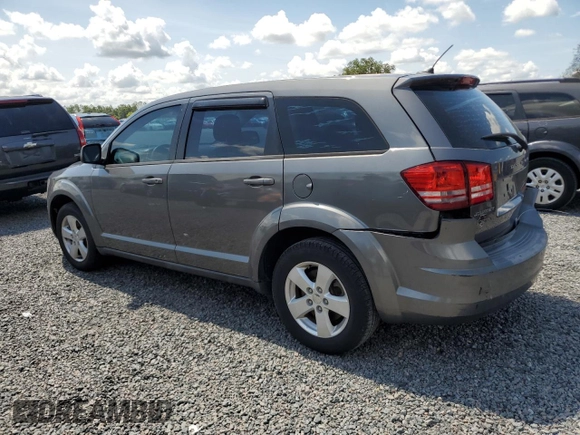2013 Dodge Journey American Value with VIN 3C4PDCAB8DT566999, listed as a Copart auction lot 61361315 with 183,897 mi miles and Salvage title. Bid and sale history available at DreamBid. Image 2.