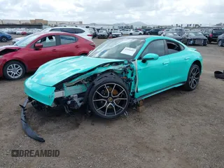 2022 Porsche Taycan 4S z VIN WP0AB2Y12NSA45396, wystawiony jako IAAI lot #41946433 z przebiegiem 9389 mil mil oraz . Historia ofert i sprzedaży dostępna na DreamBid. Obrazek 2.