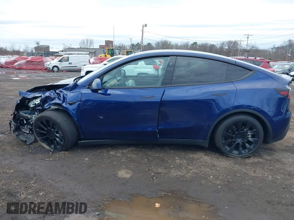 2023 Tesla Model Y Long Range with VIN 7SAYGDEE4PF891709, listed as a IAAI auction lot 41944893 with 15,864 mi miles. Bid and sale history available at carsss.com. Image 14.