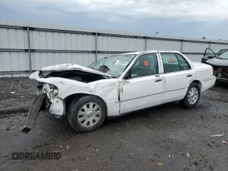 2003 Mercury Grand Marquis LS Premium with VIN 2MEFM75W13X667779, listed as a Copart auction lot 52869985 with 127,506 mi miles and Salvage Title. Bid and sale history available at DreamBid. Image 1.