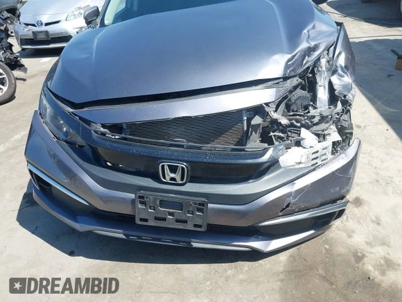 2020 Honda Civic LX with VIN 2HGFC2F67LH551651, listed as a IAAI auction lot 41861966 with 205,619 mi miles and . Bid and sale history available at DreamBid. Image 12.
