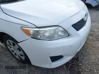 2010 Toyota Corolla with VIN 2T1BU4EE1AC312151, listed as a IAAI auction lot 42761709 with 121,356 mi miles and . Bid and sale history available at DreamBid. Image 14.