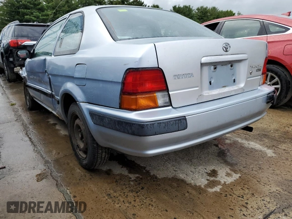 1997 Toyota Tercel CE z VIN JT2AC52L1V0227973, wystawiony jako Copart lot #56672512 z przebiegiem 301 799 mil mil oraz Szkody całkowita. Historia ofert i sprzedaży dostępna na DreamBid. Obrazek 3.