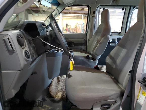 2011 Ford Econoline Cargo Commercial with VIN 1FTNE1EW6BDB02070, listed as a Copart auction lot 58601985 with 58,381 mi miles and Salvage title. Bid and sale history available at DreamBid. Image 7.
