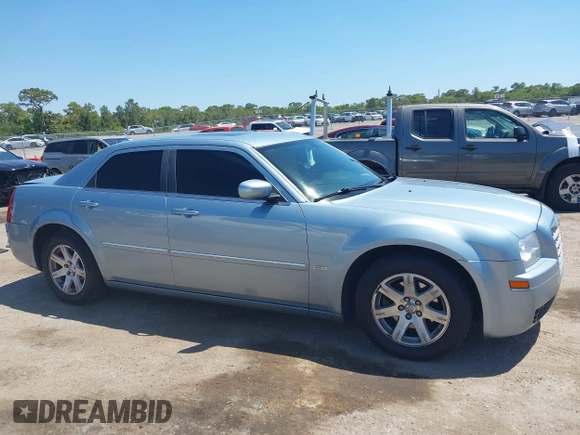 2006 Chrysler 300 Touring with VIN 2C3KA53G56H324954, listed as a IAAI auction lot 42058478 with 124,933 mi miles. Bid and sale history available at carsss.com. Image 13.