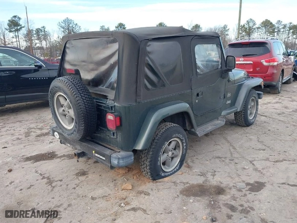 2003 Jeep Wrangler Sahara with VIN 1J4FA59SX3P344031, listed as a IAAI auction lot 41389374 with 206,407 mi miles. Bid and sale history available at carsss.com. Image 4.