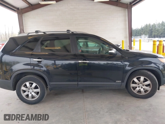 2011 Kia Sorento LX with VIN 5XYKTDA24BG170561, listed as a IAAI auction lot 42011756 with 211,833 mi miles. Bid and sale history available at carsss.com. Image 13.
