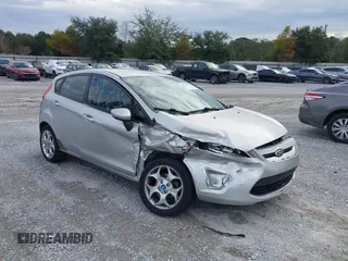 2011 Ford Fiesta SES with VIN 3FADP4FJ5BM232264, listed as a IAAI auction lot 40982622 with 184,726 mi miles. Bid and sale history available at carsss.com. Image 1.