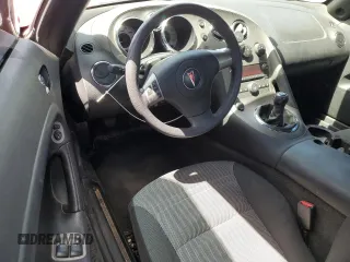 2006 Pontiac Solstice z VIN 1G2MB35B76Y116236, wystawiony jako Copart lot #53448785 z przebiegiem 105 576 mil mil oraz Szkoda całkowita • Salvage title. Historia ofert i sprzedaży dostępna na DreamBid. Obrazek 8.