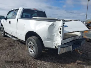 2006 Ford F-150 STX with VIN 1FTRX14W86NB32815, listed as a IAAI auction lot 41909527 with 310,653 mi miles. Bid and sale history available at carsss.com. Image 3.