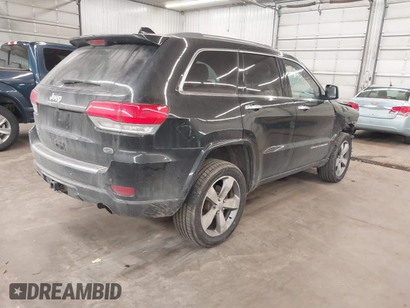 2014 Jeep Grand Cherokee Overland with VIN 1C4RJFCG8EC177899, listed as a IAAI auction lot 41695290 with 200,867 mi miles and . Bid and sale history available at DreamBid. Image 4.