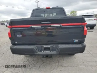 2023 Ford F-150 Lightning Pro z VIN 1FTVW1EV4PWG12935, wystawiony jako Copart lot #52685485 z przebiegiem Nie podano mil oraz Szkody całkowita. Historia ofert i sprzedaży dostępna na DreamBid. Obrazek 6.