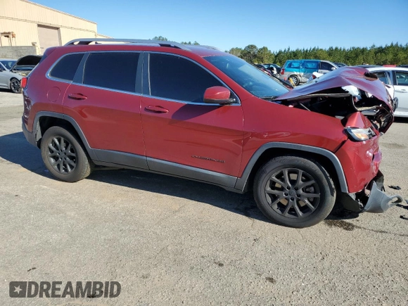 2015 Jeep Cherokee Latitude with VIN 1C4PJLCB5FW695592, listed as a Copart auction lot 50297695 with 108,091 mi miles and Salvage Title. Bid and sale history available at DreamBid. Image 4.