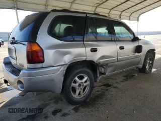 2005 GMC Envoy SLE with VIN 1GKDS13S852374516, listed as a Copart auction lot 42409725 with 299,816 mi miles and Salvage Title. Bid and sale history available at carsss.com. Image 3.