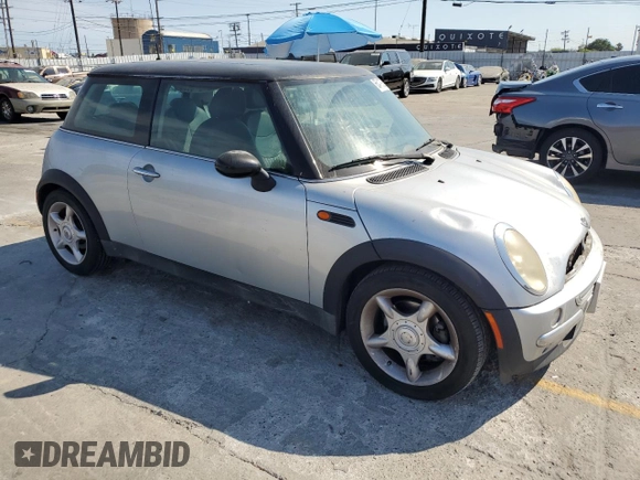 2003 MINI Hardtop with VIN WMWRC33453TE14909, listed as a Copart auction lot 65419725 with 111,960 mi miles and Salvage title. Bid and sale history available at DreamBid. Image 4.