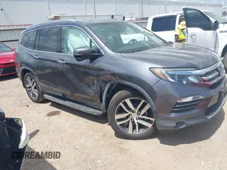 2017 Honda Pilot Touring with VIN 5FNYF5H94HB009511, listed as a IAAI auction lot 42430102 with 68,852 mi miles and . Bid and sale history available at DreamBid. Image 1.