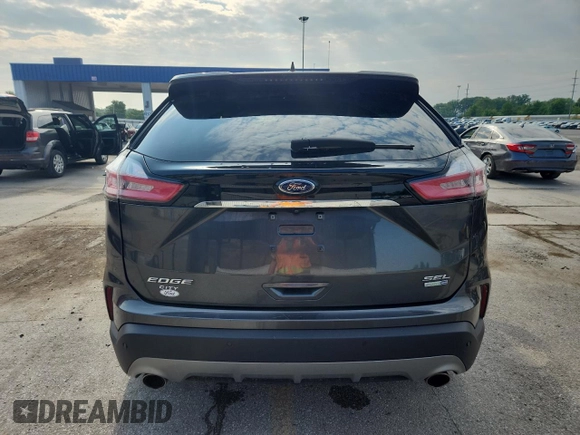 2020 Ford Edge SEL с VIN 2FMPK4J97LBA71577, выставлен на аукционе Copart как лот 60028525 с пробегом 66 365 миль миль и Списание • Salvage title. История ставок и продаж доступна на DreamBid. Изображение 6.