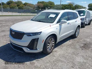 2020 Cadillac XT6 FWD Premium Luxury z VIN 1GYKPCRS1LZ228982, wystawiony jako IAAI lot #41975364 z przebiegiem 84 803 mil mil oraz . Historia ofert i sprzedaży dostępna na DreamBid. Obrazek 2.