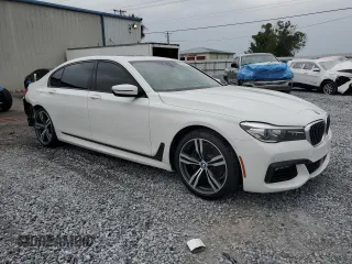 2016 BMW 7 Series 740i with VIN WBA7E2C52GG547112, listed as a Copart auction lot 63069355 with 76,867 mi miles and Salvage title. Bid and sale history available at DreamBid. Image 4.