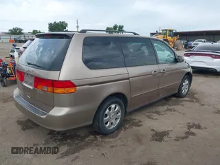 2003 Honda Odyssey EX-L z VIN 5FNRL18063B135949, wystawiony jako IAAI lot #42248105 z przebiegiem 210 567 mil mil oraz . Historia ofert i sprzedaży dostępna na DreamBid. Obrazek 4.