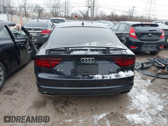 2016 Audi A7 3.0 Premium Plus with VIN WAUWGAFC0GN006470, listed as a IAAI auction lot 41638615 with 104,040 mi miles. Bid and sale history available at carsss.com. Image 16.