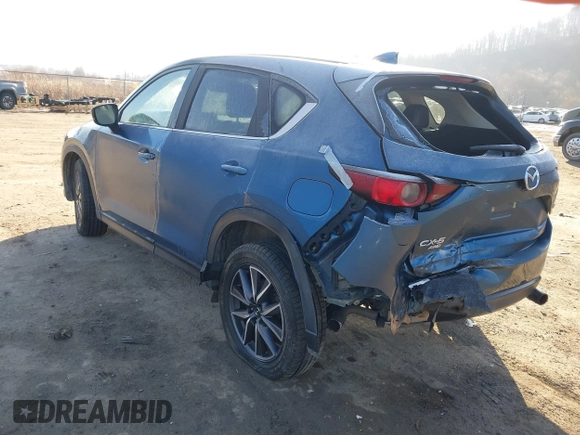 2018 Mazda CX-5 Touring z VIN JM3KFBCM2J0461954, wystawiony jako IAAI lot #41655865 z przebiegiem 129 333 mil mil oraz . Historia ofert i sprzedaży dostępna na DreamBid. Obrazek 3.