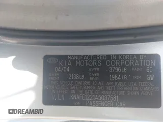 2004 Kia Spectra LX with VIN KNAFE122145037581, listed as a IAAI auction lot 41965681 with 49,817 mi miles. Bid and sale history available at carsss.com. Image 9.