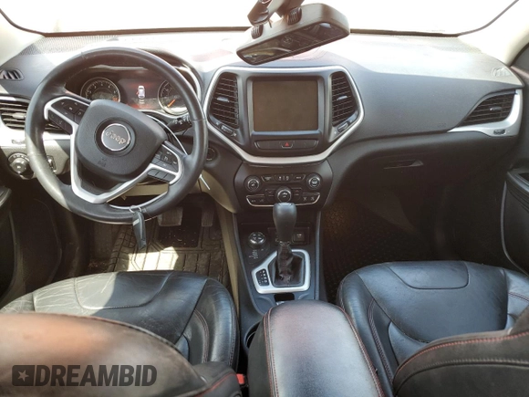 2015 Jeep Cherokee Trailhawk with VIN 1C4PJMBS5FW523019, listed as a Copart auction lot 55527955 with 107,503 mi miles and Salvage title. Bid and sale history available at DreamBid. Image 8.