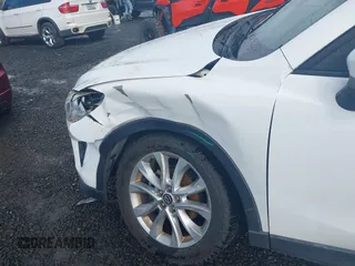2015 Mazda CX-5 Grand Touring with VIN JM3KE4DY0F0483037, listed as a IAAI auction lot 41578222 with 102,988 mi miles. Bid and sale history available at carsss.com. Image 6.