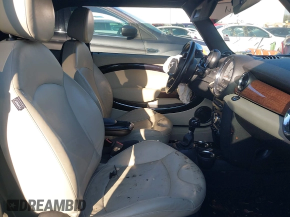 2011 MINI Convertible with VIN WMWZN3C55BT133367, listed as a IAAI auction lot 41781374 with 124,036 mi miles and . Bid and sale history available at DreamBid. Image 5.