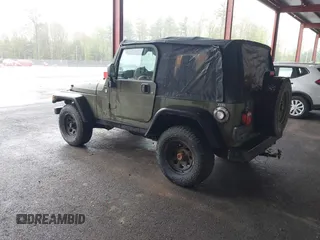 2005 Jeep Wrangler X z VIN 1J4FA39S75P310037, wystawiony jako IAAI lot #42186114 z przebiegiem 154 462 mil mil oraz . Historia ofert i sprzedaży dostępna na DreamBid. Obrazek 3.