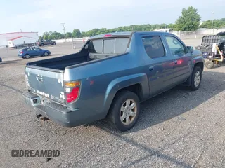 2006 Honda Ridgeline RTL with VIN 2HJYK16526H531884, listed as a IAAI auction lot 42796524 with 334,489 mi miles and . Bid and sale history available at DreamBid. Image 4.