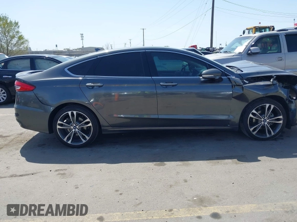 2019 Ford Fusion Titanium with VIN 3FA6P0D90KR109985, listed as a IAAI auction lot 41993329 with Not provided miles and . Bid and sale history available at DreamBid. Image 13.