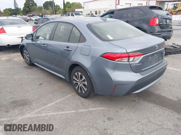2022 Toyota Corolla Hybrid LE with VIN JTDEAMDE4NJ041913, listed as a IAAI auction lot 41883490 with 23,063 mi miles. Bid and sale history available at carsss.com. Image 3.