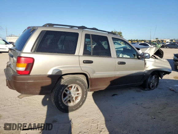 2003 Jeep Grand Cherokee Laredo z VIN 1J4GX48N63C509220, wystawiony jako Copart lot #72730964 z przebiegiem 95 216 mil mil oraz Szkoda całkowita • Salvage title. Historia ofert i sprzedaży dostępna na DreamBid. Obrazek 3.