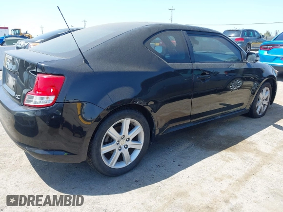 2012 Scion tC with VIN JTKJF5C79C3025581, listed as a IAAI auction lot 42170728 with 92,842 mi miles. Bid and sale history available at carsss.com. Image 4.
