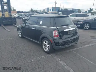 2013 MINI Cooper Hardtop with VIN WMWSU3C50DT682238, listed as a IAAI auction lot 41919592 with 148,035 mi miles. Bid and sale history available at carsss.com. Image 3.