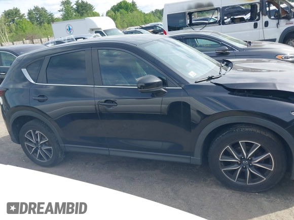 2018 Mazda CX-5 Touring z VIN JM3KFBCM9J0358997, wystawiony jako IAAI lot #42332606 z przebiegiem 93 952 mil mil oraz . Historia ofert i sprzedaży dostępna na DreamBid. Obrazek 13.