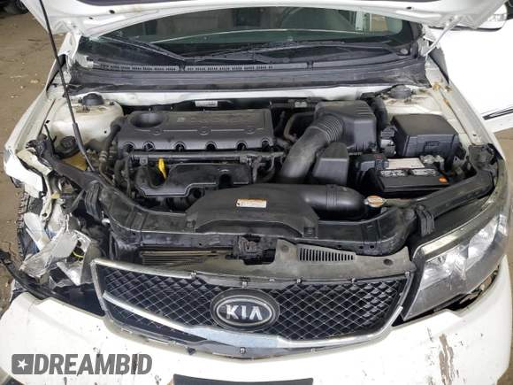 2010 Kia Forte EX z VIN KNAFU4A27A5230657, wystawiony jako Copart lot #58817345 z przebiegiem 63 949 mil mil oraz Nie do naprawy • Non repairable. Historia ofert i sprzedaży dostępna na DreamBid. Obrazek 11.