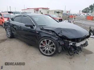 2013 Audi A7 Premium Plus with VIN WAUYGAFC7DN101757, listed as a IAAI auction lot 42485884 with 135,330 mi miles and . Bid and sale history available at DreamBid. Image 1.