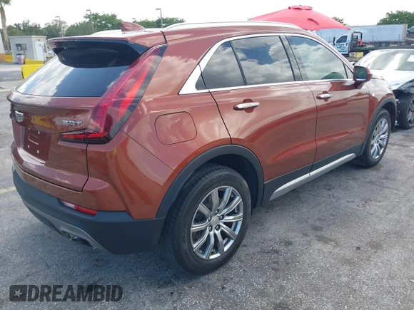 2019 Cadillac XT4 FWD Premium Luxury z VIN 1GYFZCR41KF183507, wystawiony jako IAAI lot #41987176 z przebiegiem 64 803 mil mil oraz . Historia ofert i sprzedaży dostępna na DreamBid. Obrazek 4.