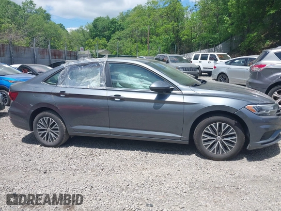 2019 Volkswagen Jetta S z VIN 3VWC57BUXKM121316, wystawiony jako IAAI lot #42290107 z przebiegiem 117 371 mil mil oraz . Historia ofert i sprzedaży dostępna na DreamBid. Obrazek 14.