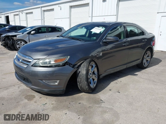 2011 Ford Taurus SHO with VIN 1FAHP2KT6BG167447, listed as a IAAI auction lot 41433934 with 201,600 mi miles and . Bid and sale history available at DreamBid. Image 2.